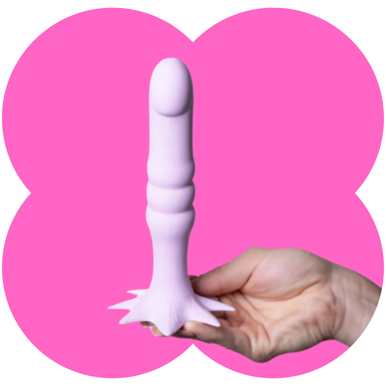 A pale pink silicone dildowith a flared base, held in a hand against a bright pink graphic background.