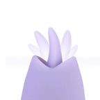 A close-up of a lavender silicone personal massager with a flower-like opening, shown against a plain white background.