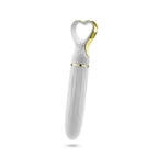 A white handheld personal massager with a heart-shaped head and gold metallic accents, shown against a plain white background.
