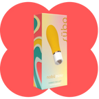 A boxed personal massager product shown upright on a white background with coral-red abstract shapes behind it. The box is pastel yellow, white, teal, and pink with a large photo of the yellow ribbed bullet massager on the front.