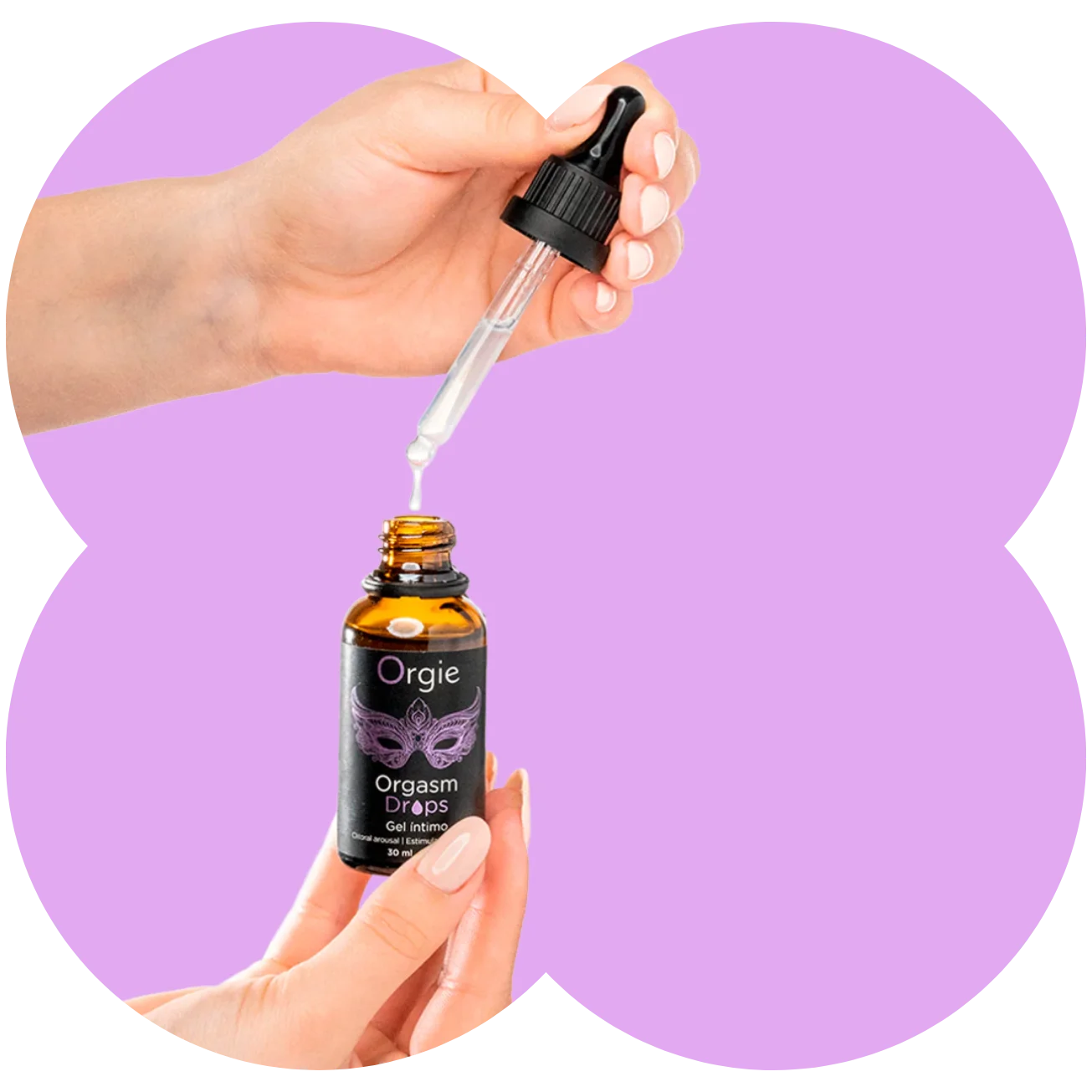 A hand holds an amber glass dropper bottle labeled Orgie Orgasm Drops while another hand positions a clear dropper above the open bottle, with a light purple abstract background.