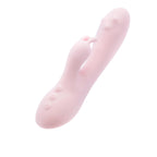 A light pink silicone personal massager with a curved shaft, a separate suction-style nozzle, and three small control buttons on the base, shown against a plain white background.